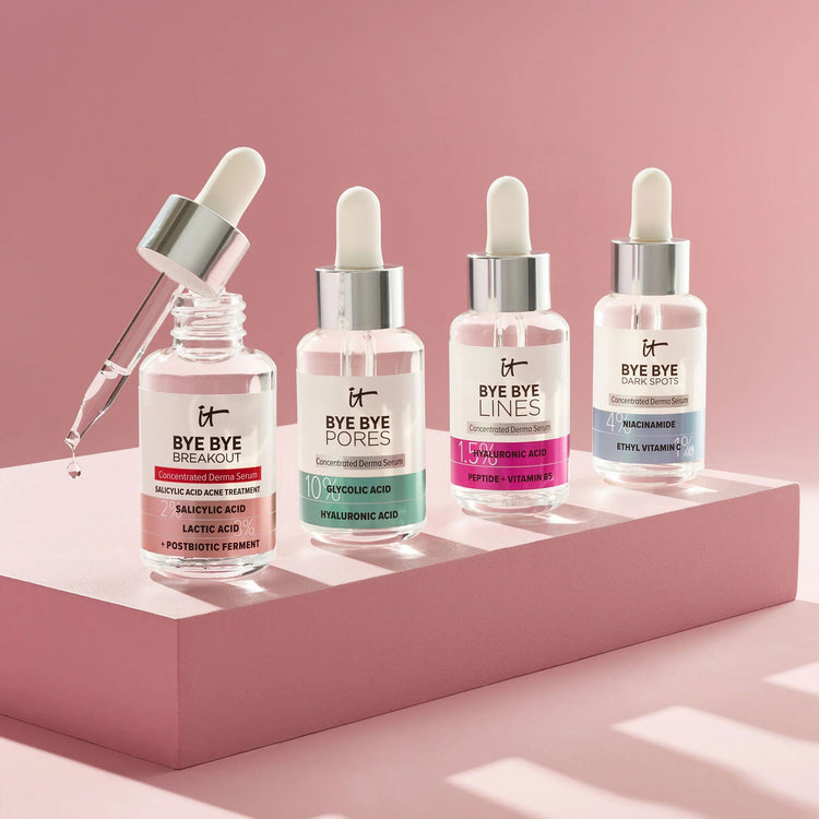 Hydrating serums for dry skin displayed in bottles with droppers on a pink background at Pinky Cosmetics