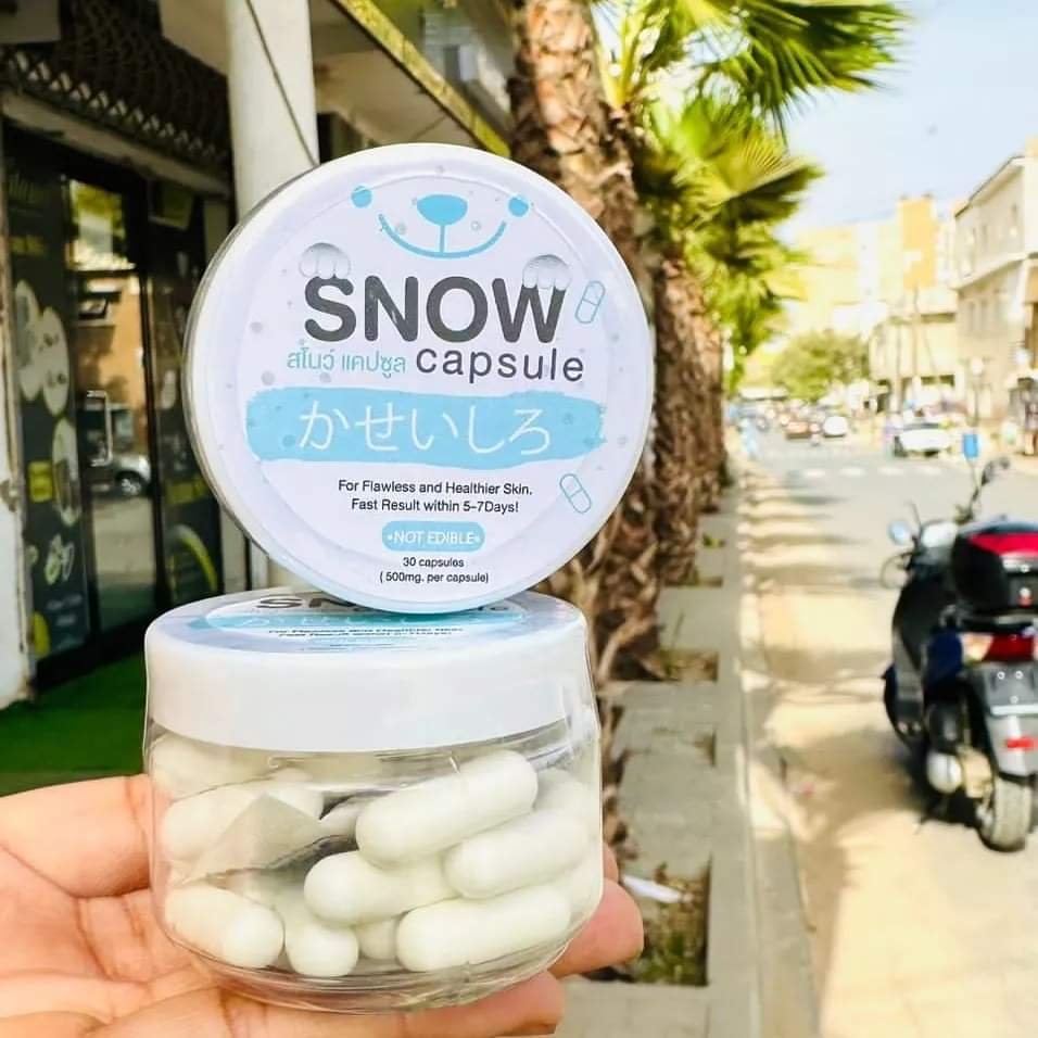 SNOW CAPSULE Arbutin Lightening Powder in a clear container, offering whitening capsules for glowing skin for healthier complexion