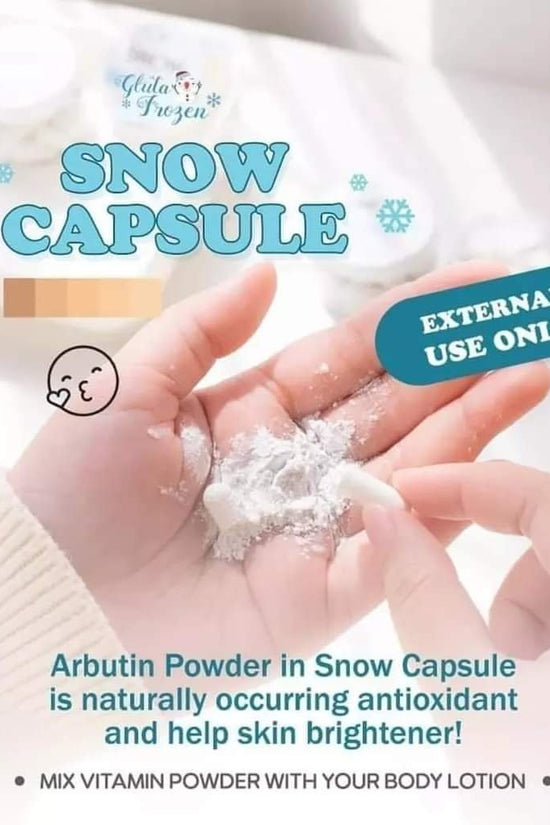 Snow Capsule Arbutin Lightening Powder in a hand, promoting whitening capsules for glowing skin with antioxidant benefits.