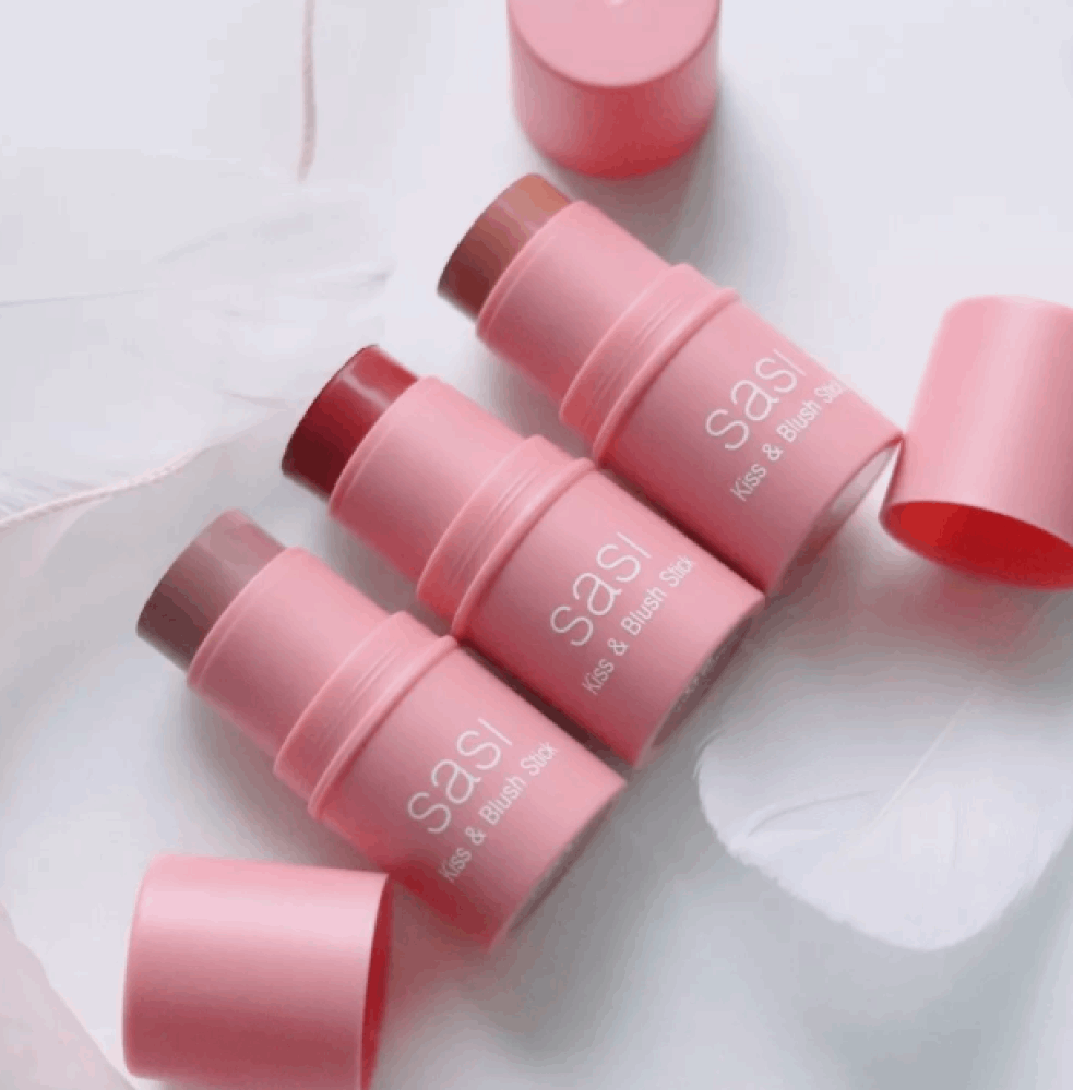 Sasi Kiss & Blush Stick set featuring three vibrant shades in pink packaging, perfect for adding a rosy glow