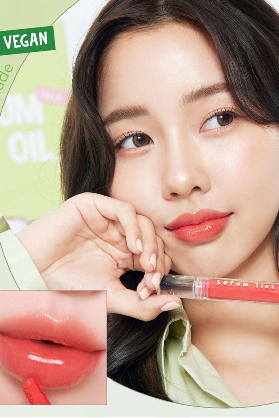 Model applying 4U2 Serum Tint Oil Lip in shade Juicy Marmalade, featuring a glossy finish for vibrant lips