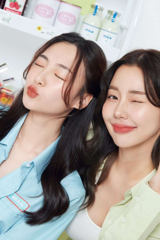 Two women showcasing the 4U2 Serum Tint Oil Lip in vibrant shades, perfect for a natural look and hydration.