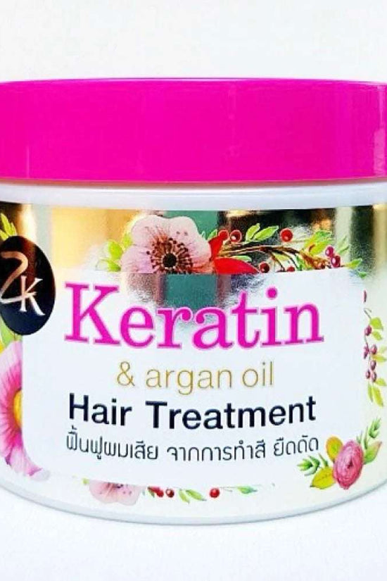 Keratin hair treatment with Argan oil in a pink container, designed to nourish and rejuvenate hair for a healthy shine