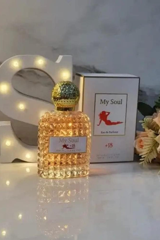 My Soul perfume women's 100ml in a diamond-shaped bottle beside the elegant packaging and flowers on a marble background