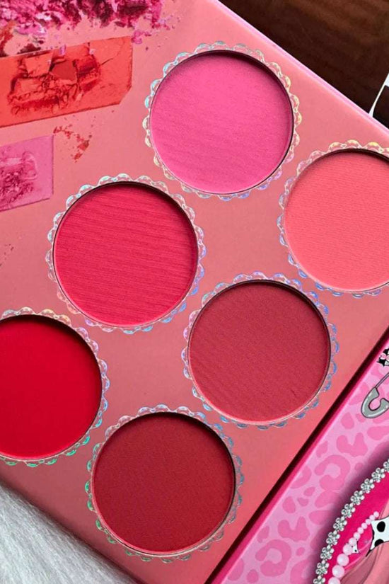 Colorful 4 in 1 makeup palette featuring six shades of blush in pink and red tones for versatile makeup looks