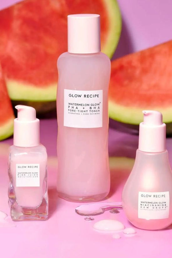 Glow Recipe skincare products with watermelon slices on a pink background
