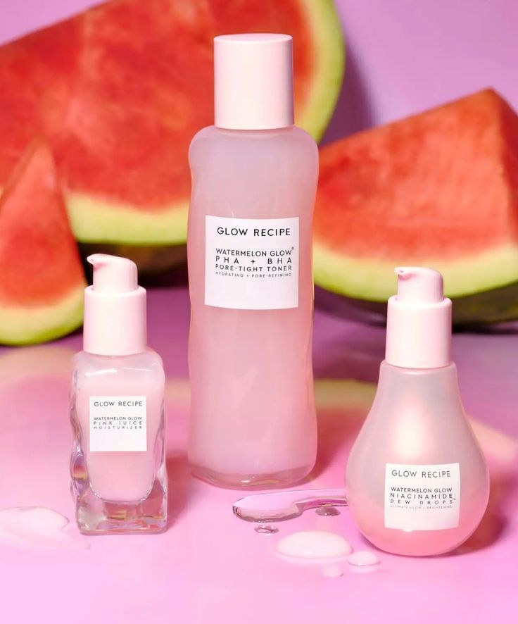Glow Recipe skincare products with watermelon slices on a pink background