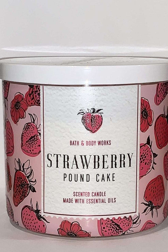 Bath & Body Works Strawberry Pound Cake candle featuring a vibrant strawberry design, made with essential oils for a delightful scent