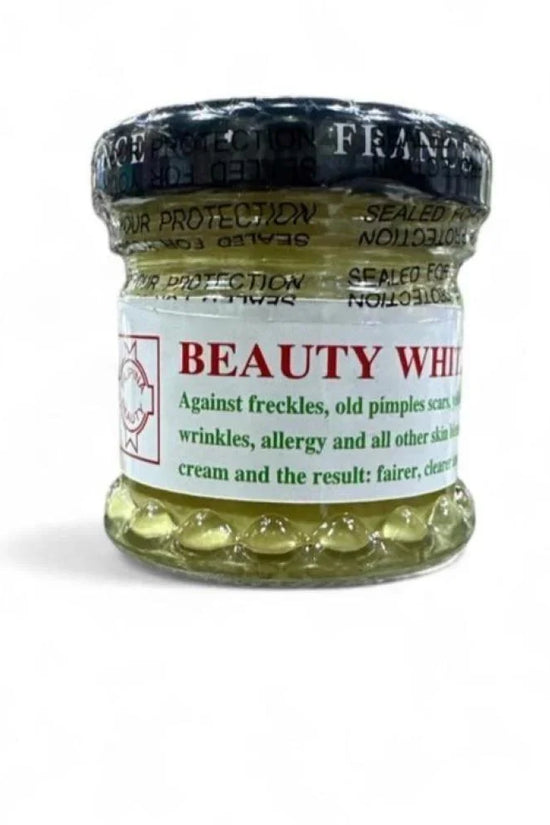 Dalfour French Whitening Cream in a small glass jar designed to lighten skin, targeting freckles and dark spots