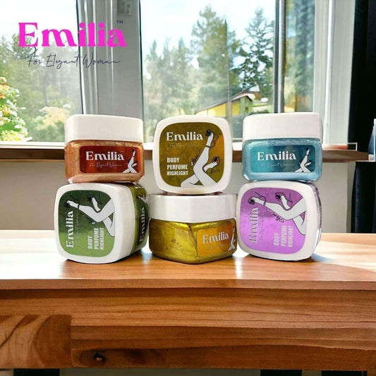 Emilia High Light body perfume collection featuring colorful jars, displayed on a wooden table with natural light