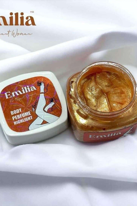 Emilia High Light body perfume in a charming jar showcasing golden shimmer, perfect for enhancing natural beauty.