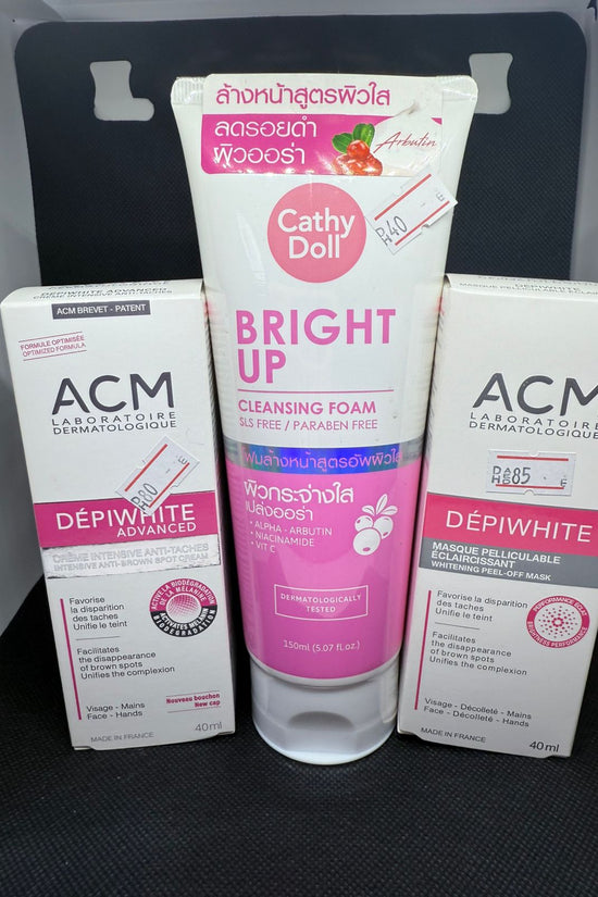 Cathy Doll Bright Up Cleansing Foam and ACM Depiwhite products on a black surface