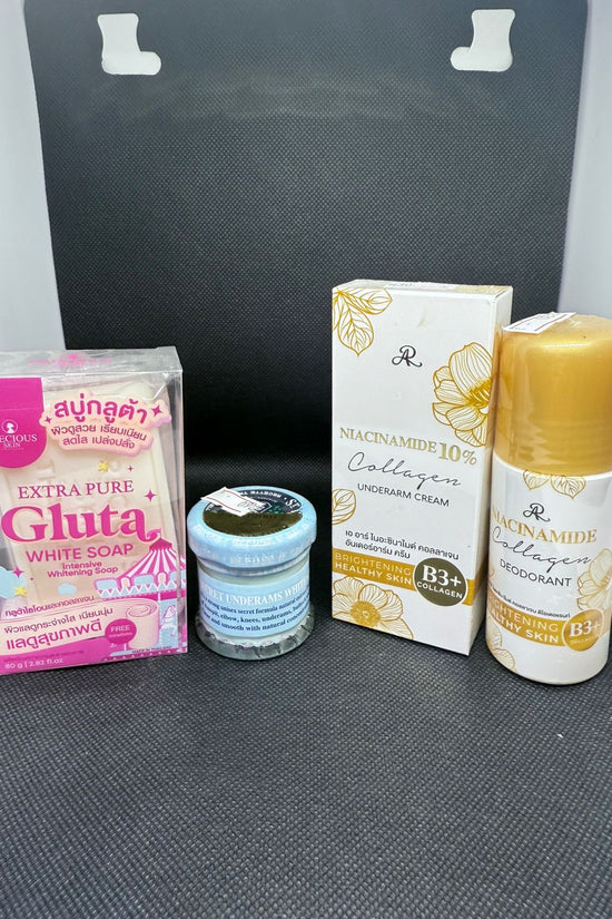 Collection of skincare and personal care products on a gray surface with a black background.