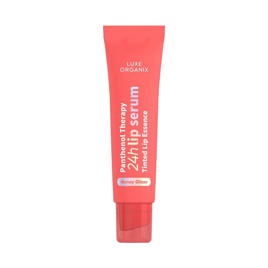 Luxe Organix lip serum in tinted Honey Glaze, featuring a sleek tube design for hydration and color enhancement