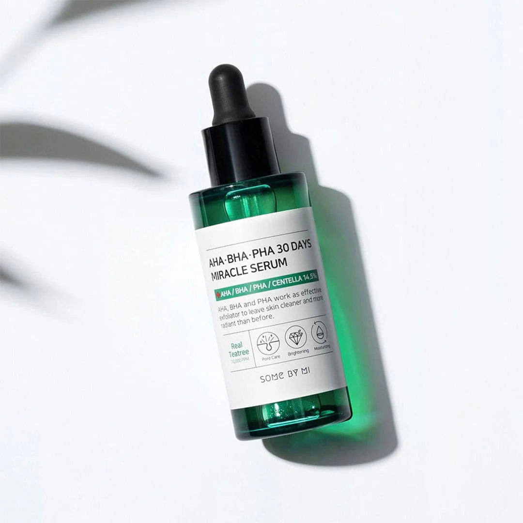 SOME BY MI AHA BHA PHA serum in a sleek green bottle with a dropper, designed for glowing skin and skincare miracles