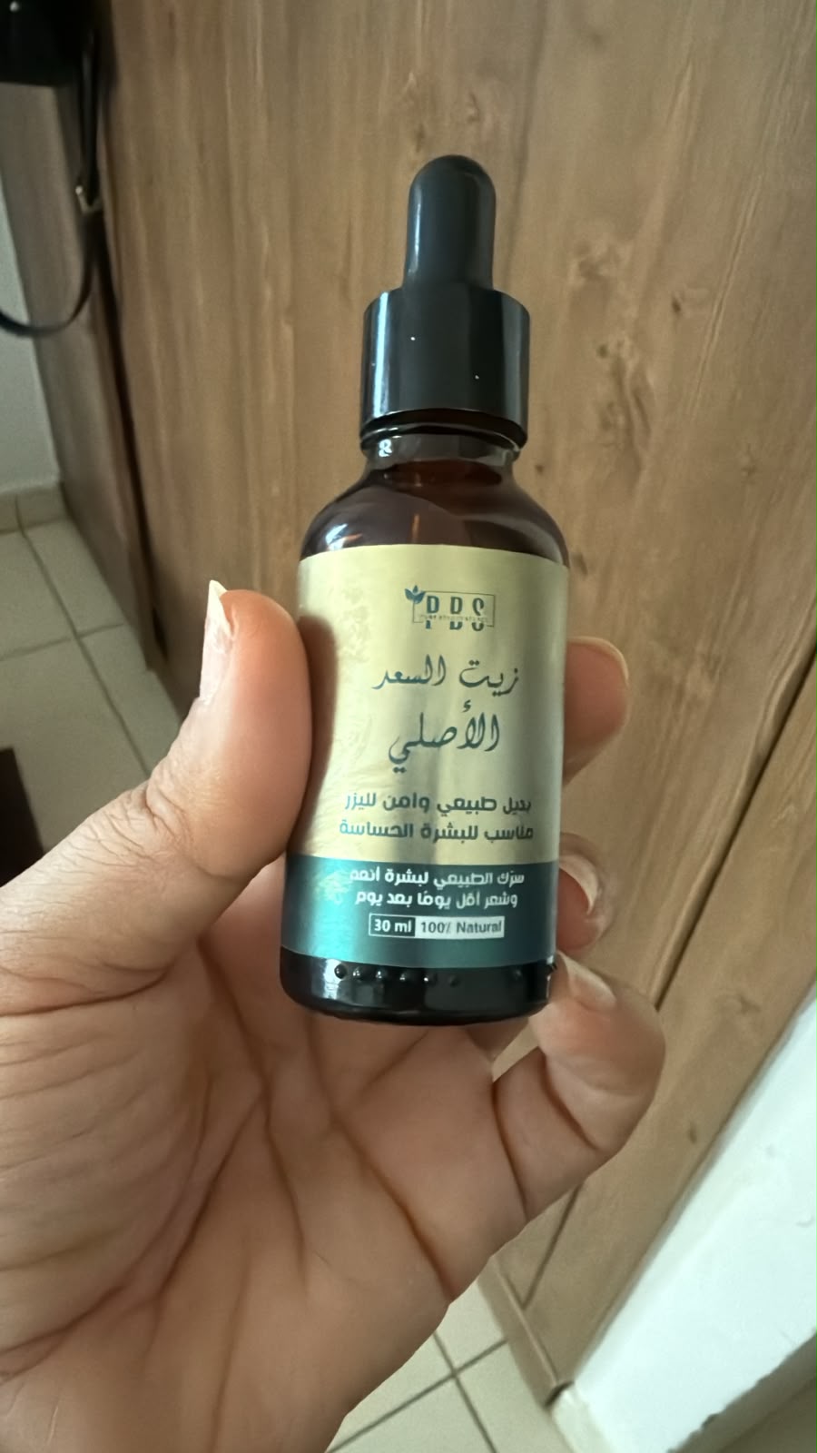 DDS Original Saad Oil 30ml – luxury gold editorial shot on stone pedestal