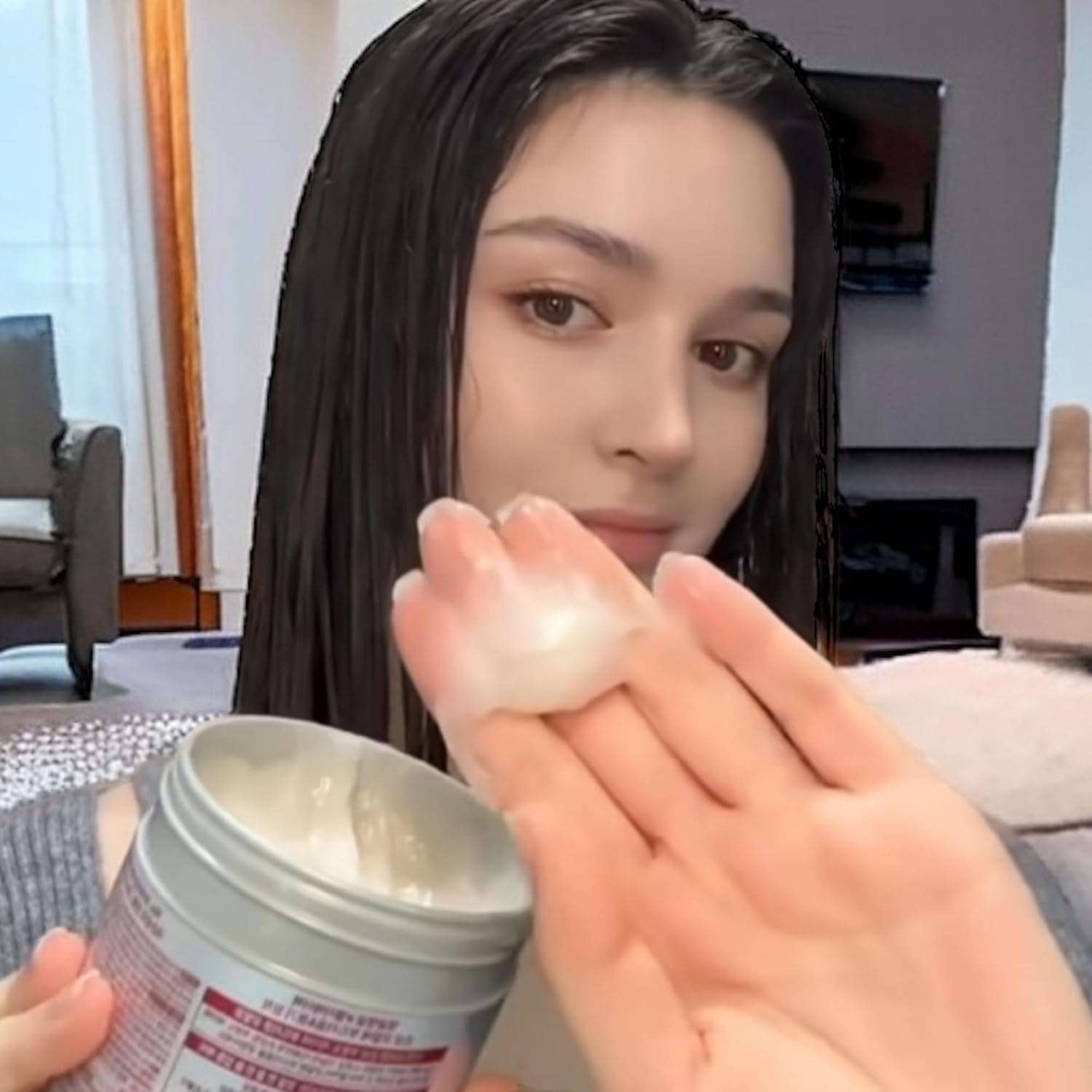 Woman applying Fino hair mask Japan to her hair for deep conditioning and hydration