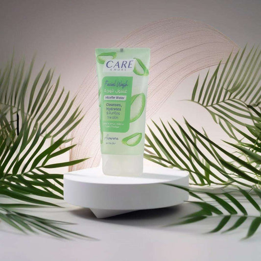 CAREMORE Aloe Vera facial wash for oily skin in a fresh green tube, surrounded by palm leaves on a white pedestal