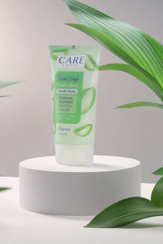CAREMORE Aloe Vera facial wash for oily skin in a stylish tube, displayed with green leaves for a fresh look