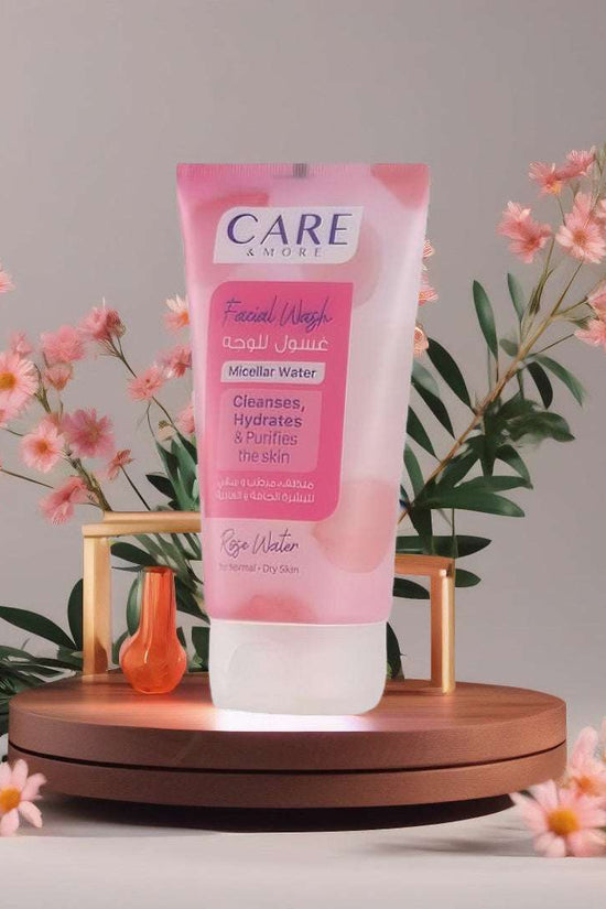CAREMORE Rose Water Facial Wash in a pink tube, a hydrating facial cleanser for normal skin, surrounded by flowers and leaves