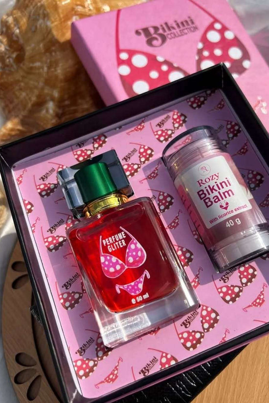The New Bikini Box featuring a red perfume and bikini balm with licorice extract for glowing skin and allure