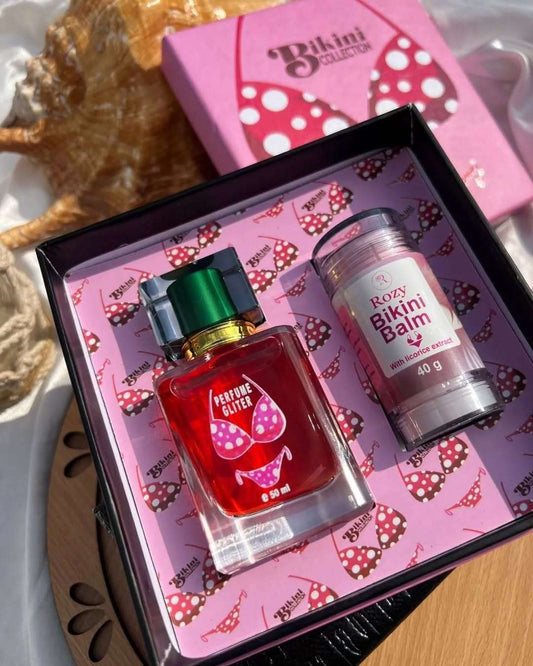 The New Bikini Box featuring a red perfume and bikini balm with licorice extract for glowing skin and allure