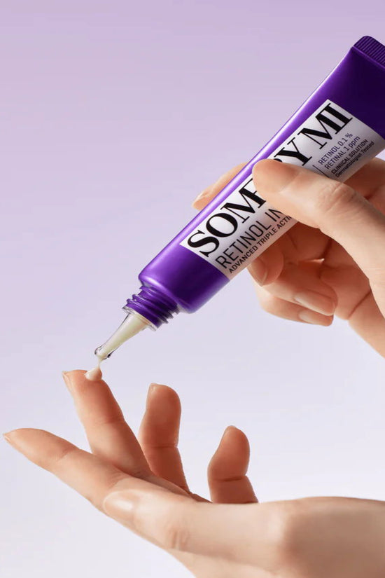 Advanced retinol eye cream for dark circles in 30ml tube being dispensed onto a hand