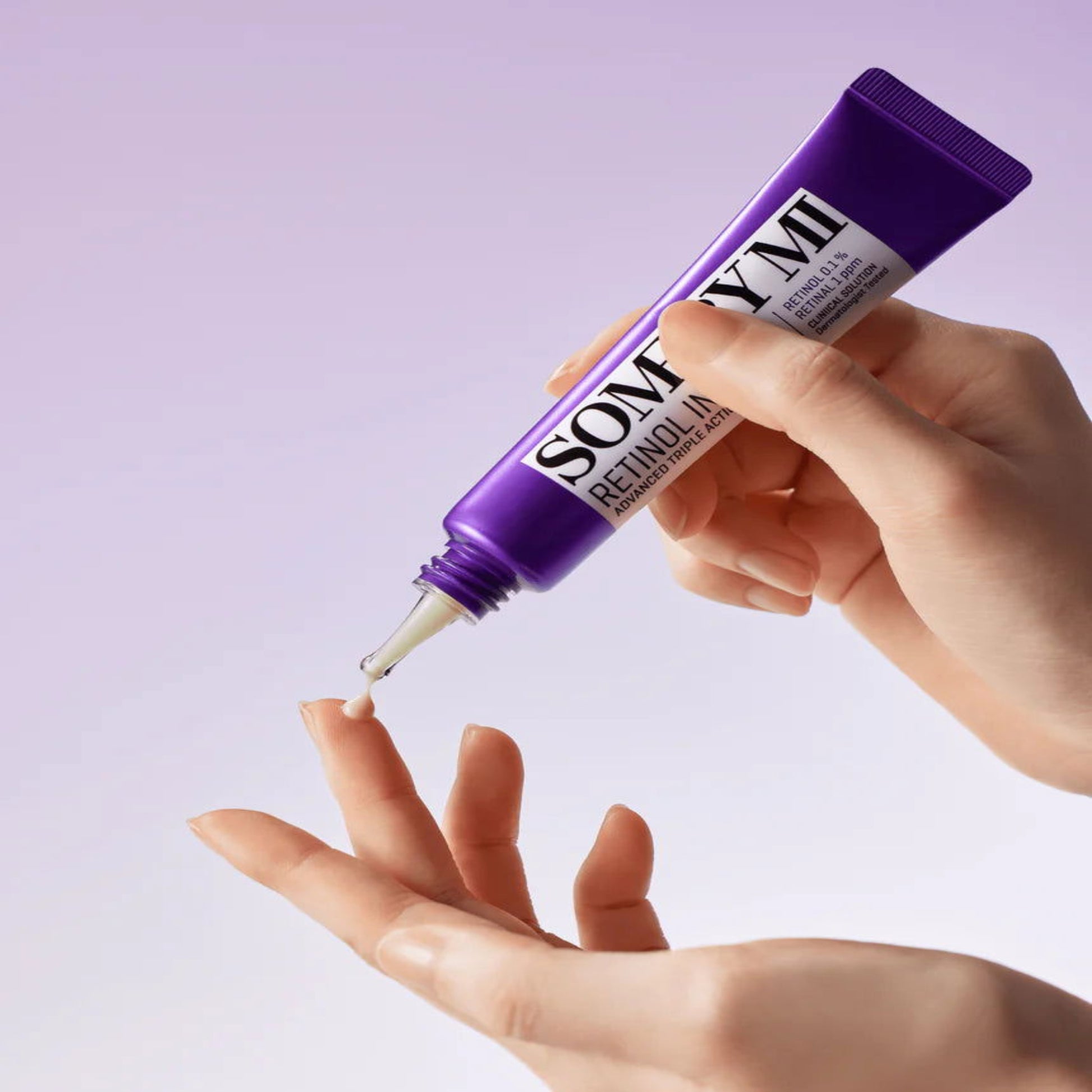 Advanced retinol eye cream for dark circles in 30ml tube being dispensed onto a hand