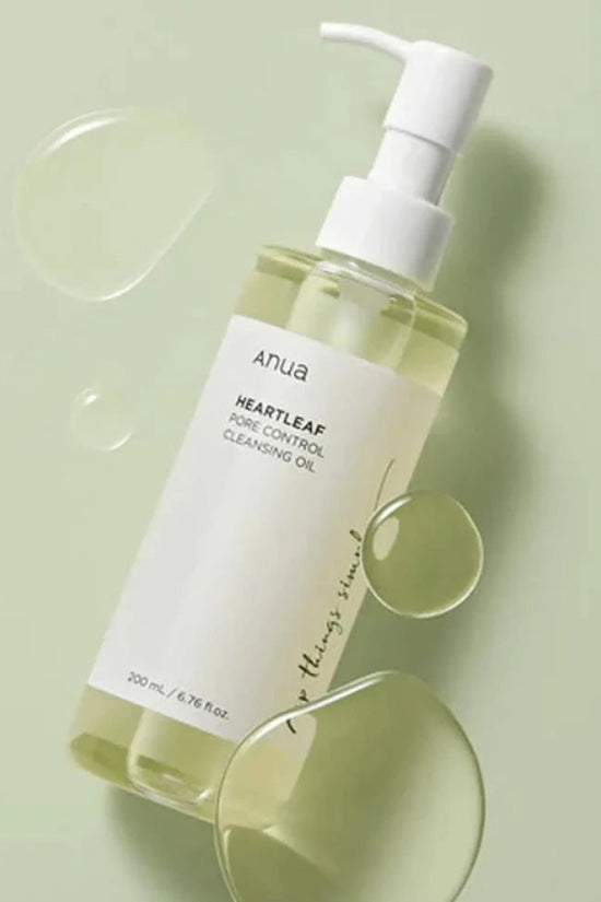 Anua Heartleaf Pore Control Cleanser for oily skin in a 200ml pump bottle with a light green background