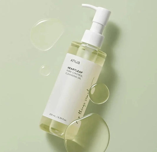 Anua Heartleaf Pore Control Cleanser for oily skin in a 200ml pump bottle with a light green background
