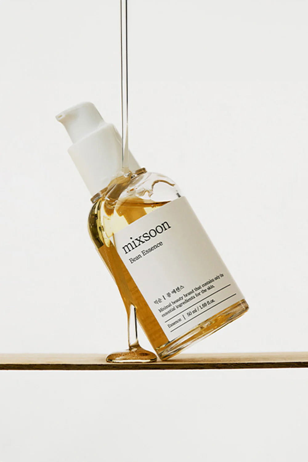 Mixsooon Bean Essence facial serum in clear bottle with pump for glowing skin and hydration