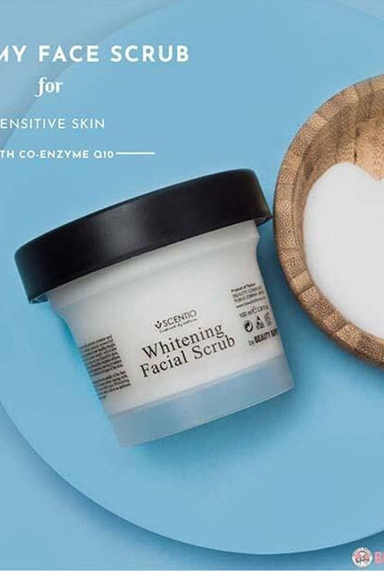 Scentio Milk Plus Facial Scrub for sensitive skin in a white jar with a black lid and creamy texture